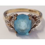 9CT YELLOW GOLD OVAL BLUE STONE AND DIAMOND RING, 3.1G SIZE R