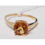 A 9CT YELLOW GOLD RING WITH GOLDEN BROWN STONE STAMPED SIZE T+ 2.1G GROSS