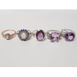 FIVE SILVER RINGS OF VARIOUS DESIGNS THREE WITH PURPLE STONES ALL STAMPED 925 SIZES R TO T+ 31.3G