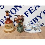 A STUDIO POTTERY MODEL OF A TAWNY OWL AN EMPTY BELL'S WHISKY BOTTLE AND A CONTINENTAL GROUP