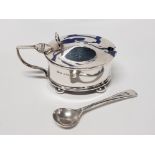 A GEORGE V SILVER MUSTARD POT WITH BLUE GLASS LINER BIRMINGHAM 1932 AND A GEORGE V SILVER MUSTARD