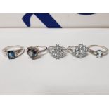 FIVE SILVER RINGS OF VARIOUS DESIGNS WITH BLUE STONES ALL STAMPED 925 19.4G GROSS