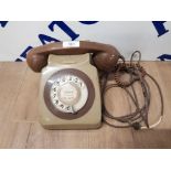A VINTAGE TELEPHONE IN BROWN AND GREEN