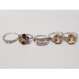 FIVE SILVER RINGS OF VARIOUS DESIGNS FOUR WITH LIGHT BROWN STONES ALL STAMPED 925 SIZES R TO U 21.3G