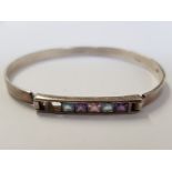 SILVER TOPAZ AND AMETHYST BANGLE, 1 STONE MISSING, 12.8G GROSS