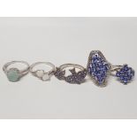 FIVE SILVER RINGS OF VARIOUS DESIGNS THREE WITH PURPLE STONES ALL STAMPED 925 SIZES P TO T 23G
