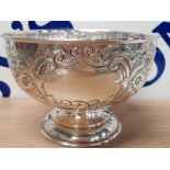 A LATE VICTORIAN OR EDWARDIAN SILVER ROSE BOWL WITH REPOUSSE DECORATION BY SAMUEL M LEVI