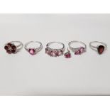 FIVE SILVER RINGS OF VARIOUS DESIGNS WITH PINK AND RED STONES AND A SINGLE ALL STAMPED 925 SIZES S