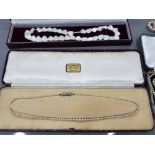A PEARL NECKLACE BY W W KEMP AND SON TWO FAUX PEARL NECKLACES AND A MOTHER OF PEARL NECKLACE WITH