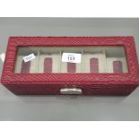 A MELE AND CO RED PYTHON SKIN EFFECT WATCH CASE WITH 5 COMPARTMENTS WITH KEY
