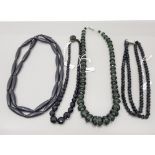 THREE FRENCH JET NECKLACES AND A WHITBY JET NECKLACE