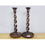 TWO OAK OPEN TWIST CANDLESTICKS WITH BRASS DRIP TRAYS