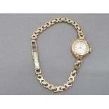 A 9CT YELLOW GOLD LADIES COCKTAIL WATCH BY ROTARY WITH 9CT STRAP 11.2G GROSS