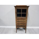 AN EDWARDIAN INLAID MAHOGANY CABINET WITH FOUR DRAWERS BELOW GLAZED DOOR 52 X 123 X 37CM