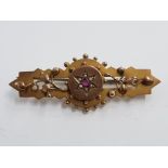 VICTORIAN 9CT GOLD AND RUBY BROOCH 3.8G GROSS
