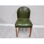 A GREEN LEATHER EFFECT CHAIR ON BEECH FRAME WITH STUD DECORATION