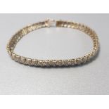 9CT YELLOW GOLD DIAMOND BRACELET APPROXIMATELY. 25CTS 8.5G GROSS