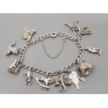 A SILVER CHARM BRACELET WITH 10 CHARMS 27.3G