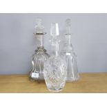 2 BELL SHAPED NEWCASTLE DECANTERS WITH HEAVY MOULDED PILLARS AND REPLACEMENT STOPPERS PLUS A CUT