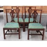 A SET OF FOUR GEORGIAN MAHOGANY DINING CHAIRS WITH WIDE DROP IN SEATS TOGETHER WITH ANOTHER