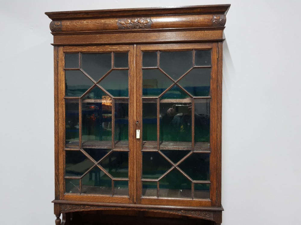 AN EARLY 20TH CENTURY OAK SECRETAIRE LEATHER TOP WITH GLAZED ASTRAGAL BOOKCASE ABOVE 94 X 196 X - Image 4 of 4