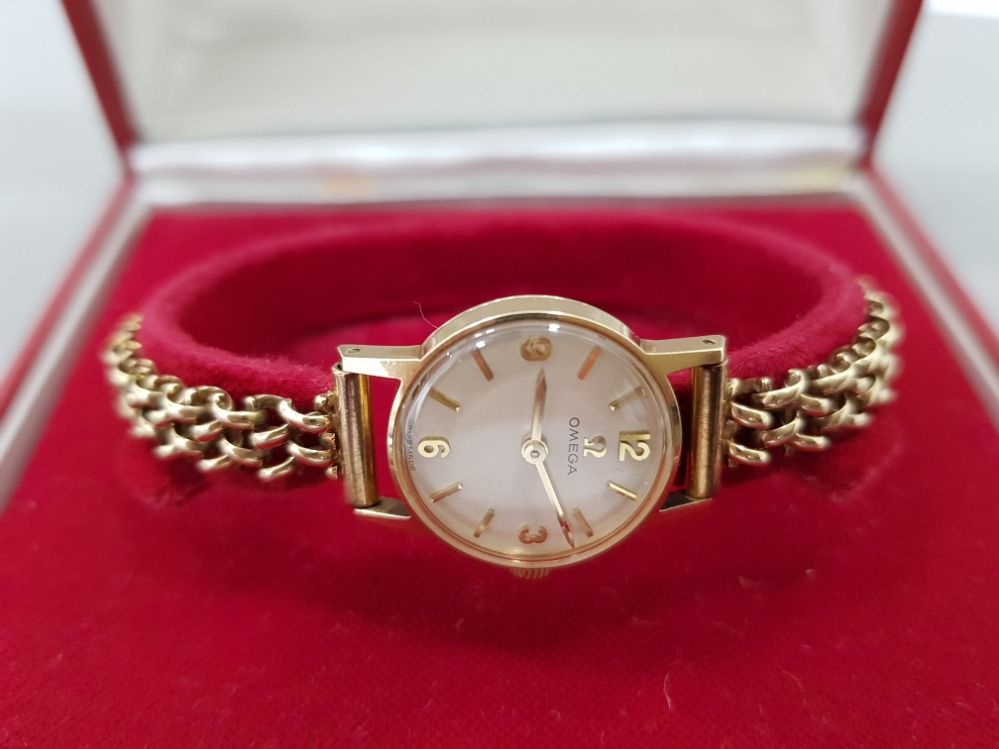 A 9CT YELLOW GOLD OMEGA LADIES COCKTAIL WATCH ON 9CT GOLD STRAP 14.4G GROSS BOXED WITH SERVICE