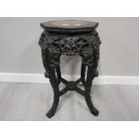 AN EARLY 20TH CENTURY CHINESE HARDWOOD PLANT STAND WITH INSET MARBLE TOP 61CM HIGH