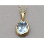 A 9CT YELLOW GOLD AND PALE BLUE STONE PENDANT ON 9CT GOLD CHAIN (CLASP REPLACED) 2.2G GROSS