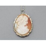 A SILVER MOUNTED AND MARCASITE CAMEO PENDANT ON WHITE METAL CHAIN 7G GROSS