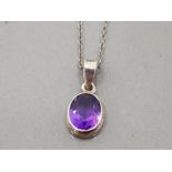 A SILVER AND PURPLE STONE PENDANT ON WHITE METAL CHAIN 3G GROSS