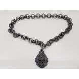 A VICTORIAN WHITBY CARVED JET PENDANT AND LINK CHAIN