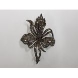 A SILVER AND MARCASITE ORCHID PATTERN BROOCH 22.8G GROSS