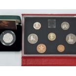 1985 DELUXE LEATHER YEARLY SET AND A 2005 SILVER PROOF PIEDFORT 50P COIN OF SAMUEL JOHNSON IN