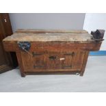 A SOLID WORK BENCH WITH RECORD NO52 BENCH VICE AND A ROEBUCK N03 BENCH VICE