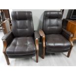 A PAIR OF LEATHER EFFECT OPEN ARMCHAIRS