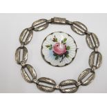 A NORWEGIAN SILVER AND ENAMEL ROSE PATTERN BROOCH AND A SILVER BRACELET 15.4G GROSS