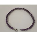 PURPLE STONE AND SILVER TENNIS BRACELET 19.5CM