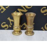 A PAIR OF FLARED BRASS VASES RAISED ON CIRCULAR BASES 20.5CM