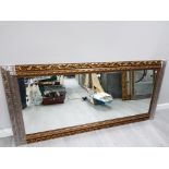 A LARGE MIRROR IN GOLD COLOURED SCROLLING FRAME 81 X 172CM