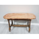 WOODEN COFFEE TABLE WITH COPPER TOP AND CASTORS