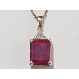 9CT GOLD RED STONE AND DIAMOND PENDANT ON SILVER GILT CHAIN, 4.3G GROSS