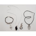 4 SILVER PENDANTS, ONE WITH SILVER CHAIN, ONE SILVER BRACELET AND ONE SKIN NECKLACE WITH SILVER