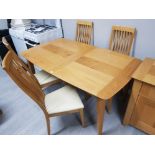 A YORK OAK EXTENDING DINING TABLE WITH ONE SPARE LEAF 224CM X 75 X 94CM FULLY EXTENDED FOUR MATCHING