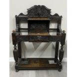 EARLY 20TH CENTURY HEAVILY CARVED OAK HALL STAND WITH CARVED LION HEAD 123CM X 95CM