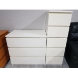 A MODERN WHITE LAMINATE CHEST OF THREE DRAWERS AND MATCHING NARROW FIVE DRAWERS 80 X 77 X 48.5CM AND