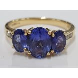 18CT YELLOW GOLD AND TANZANITE SET RING, CLARITY VS, COLOUR AAA MINIMUM, OVAL SHAPED CUT WITH