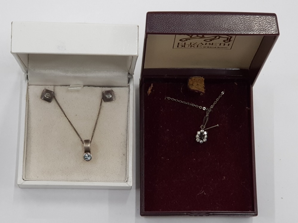 A SILVER AND BLUE STONE PENDANT ON SILVER CHAIN WITH MATCHING EARRINGS BY KIT HEATH BOXED TOGETHER