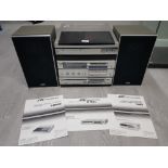A JVC HI FI SYSTEM WITH SPEAKERS AND INSTRUCTION BOOKS