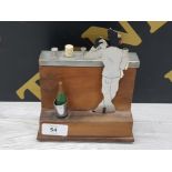 MID 20TH CENTURY CIGARETTE DISPENSER IN THE FORM OF A BARTENDER WITH MUSICAL TUNE WHEN OPENED,
