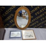 AN OVAL BEVELLED WALL MIRROR IN GILT FRAME TOGETHER WITH A WATERCOLOUR AND A PRINT